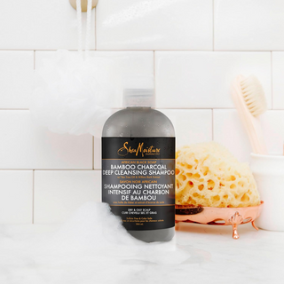 SheaMoisture sulfate-free shampoo with African Black Soap, Bamboo Charcoal, Tea Tree Oil, and Willow Bark Extract. Cleanses and soothes scalp, revitalizes hair. Ethically traded, cruelty-free